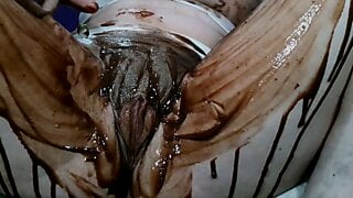 Brazilian_Miss soaking her pussy with chocolate over Clit