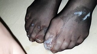 Black nylon sock on Wife’s french toenails in detail covered by big cum load