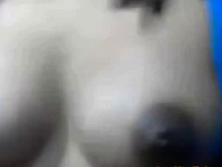 Squeezes out milk from her dark nip ttis