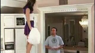 Young Cheerleader Dances on Teble